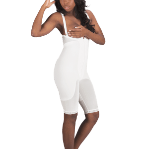 A woman wearing a white non-zippered body girdle bodysuit by Design Veronique