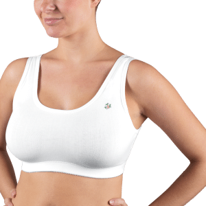 A woman models a white cotton medical sports bra by Design Veronique.