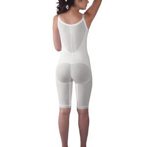 Back view of a woman in a white bodysuit featuring the zippered above-knee molded buttocks high-back girdle by Design Veronique.